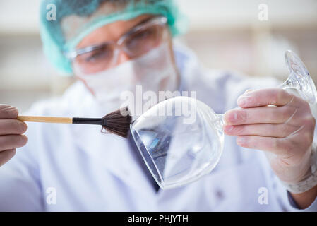 Forensics investigator working in lab on crime evidence Stock Photo