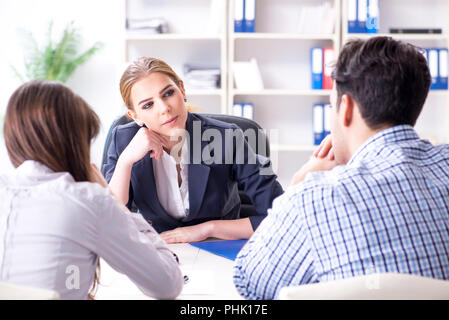 Young family filing divorce papers with lawyer Stock Photo