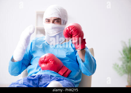 Injured boxer recovering in hospital Stock Photo