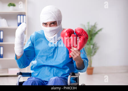 Injured boxer recovering in hospital Stock Photo