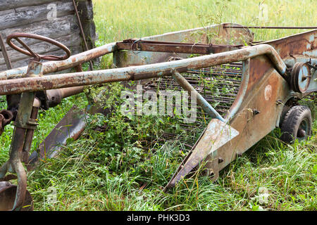 part of the old trailer and metal structures used in rural areas to work in agriculture, closeup Stock Photo