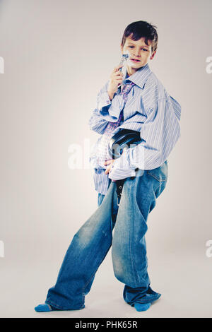 funny boy wearing Dad's clothes Stock Photo