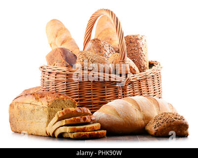 Wicker basket with assorted baking products isolated on white background Stock Photo
