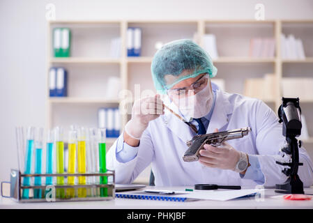 Forensics investigator working in lab on crime evidence Stock Photo