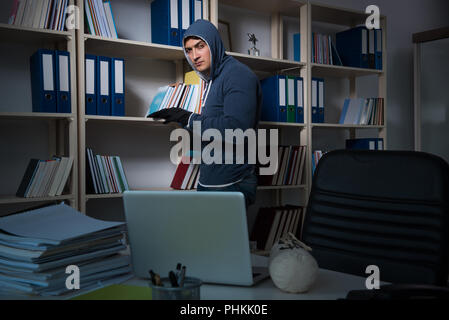 Young man in industrial espionage concept Stock Photo