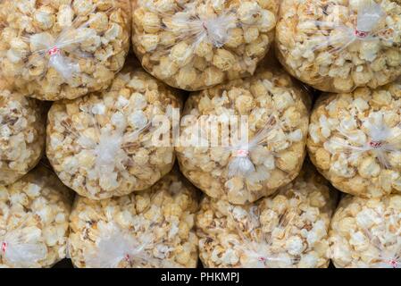 Stacked plastic-packed popcorn Stock Photo