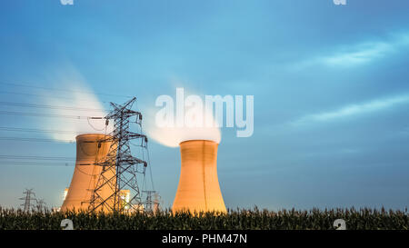 cooling tower of power plant in nightfall Stock Photo