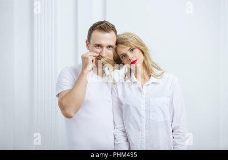 Cute young couple fooling around indoors Stock Photo