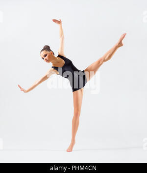 Young ballerina (on grey version) Stock Photo