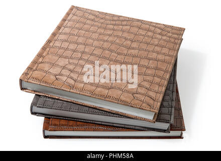 hardcover books lying on a white background Stock Photo