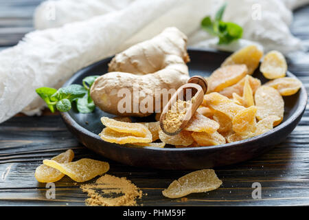 Root and ground ginger, spicy ginger candied fruit. Stock Photo