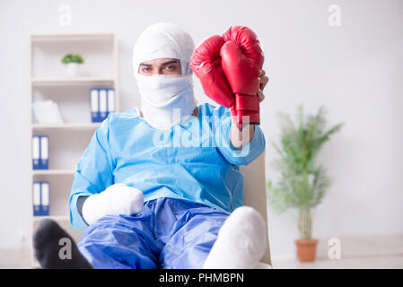 Injured boxer recovering in hospital Stock Photo