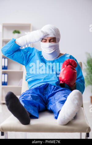 Injured boxer recovering in hospital Stock Photo