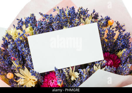Dried flowers bouquet and paper card Stock Photo