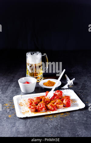 curry bockwurst with beer Stock Photo