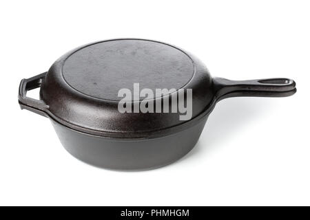 Empty, clean black cast iron pan or dutch oven over white background Stock Photo
