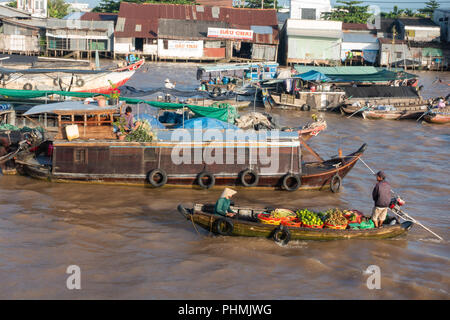Tourists and people buy and sell on boat, ship in Cai Rang floating market at Mekong River. Royalty free stock image of the floating market Stock Photo