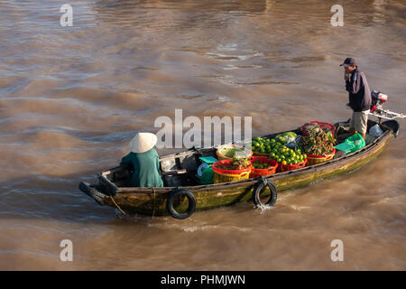 Tourists and people buy and sell on boat, ship in Cai Rang floating market at Mekong River. Royalty free stock image of the floating market Stock Photo