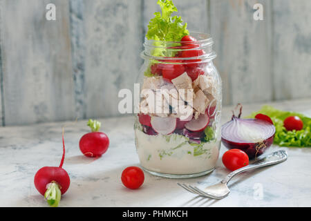 Salad with chicken and fresh vegetables in jar. Stock Photo