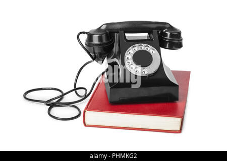 Vintage telephone and book Stock Photo