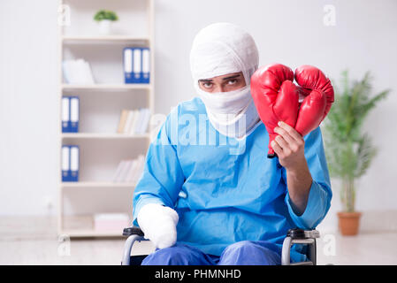 Injured boxer recovering in hospital Stock Photo