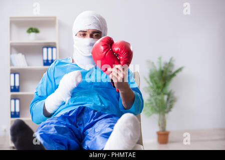 Injured boxer recovering in hospital Stock Photo