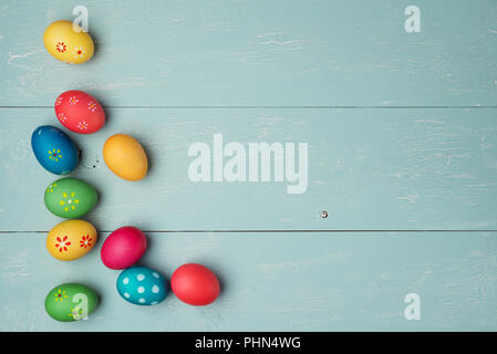 multicolored easter eggs on vintage  wooden background Stock Photo