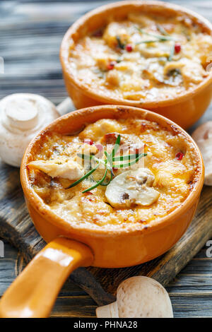Baked chicken,mushrooms and cheese in creamy sauce. Stock Photo