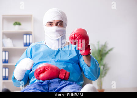 Injured boxer recovering in hospital Stock Photo