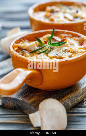 Baked chicken,mushrooms and cheese in creamy sauce. Stock Photo