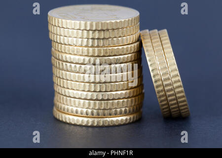 a pile of euro cents for fifty lying on a black paper surface, in focus a rib of money Stock Photo