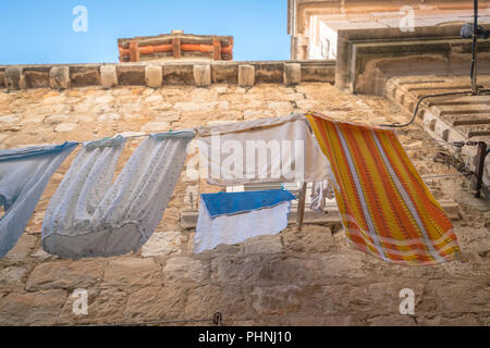 Laundry drying on a clothesline Stock Photo