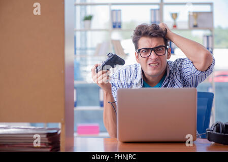 Gamer addict playing computer games at home Stock Photo