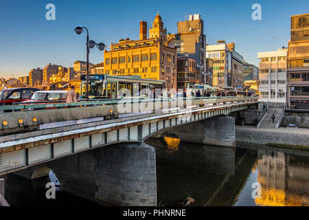 Autumn morning walk along Kamogawa River, Kyoto, Japan Stock Photo