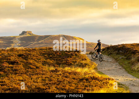 Clwydian Range, North, UK. 2nd Sep, 2018. UK Weather: Warm weather already over the Clwydian Range that divides the counties of Flintshire and Denbighshire. An early morning mountain biker cycling amongst the autumnal colours along the Offa's Dyke Path towards the summit of Moel Famau the highest point the the range on the boarder of Flintshire and Denbighshire Stock Photo