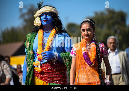 Watford, UK. 2 September 2018. (L to R) Kushal and Shivanee, students at Avanti School in Stanmore, dress as Lord Krishna and his consort Radharani, as thousands of devotees attend the biggest Janmashtami festival outside of India at the Bhaktivedanta Manor Hare Krishna Temple in Watford, Hertfordshire.  The event celebrates the birth of Lord Krishna and take place at a property donated to the Hare Krishna movement by ex Beatle George Harrison.  Credit: Stephen Chung / Alamy Live News Stock Photo