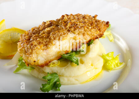 Baked Cod fish with mashed potato Stock Photo