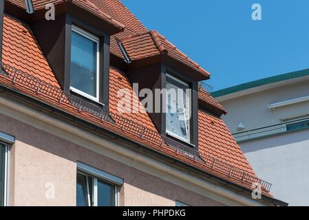 Broken fly screen on a roof window Stock Photo