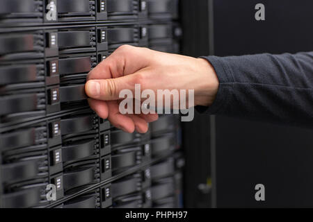 Close-up of IT Consultant Maintain SAN and Servers in Datacenter Stock Photo