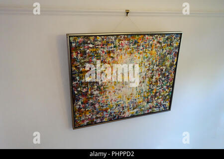 Original Contemporary Art painting in acrilics framed and hanging from picture rail in Victorian house Stock Photo