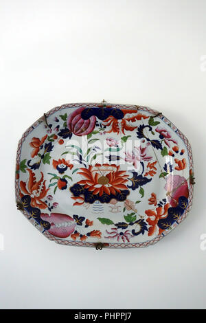 Antique serving plate mounted on home wall Stock Photo