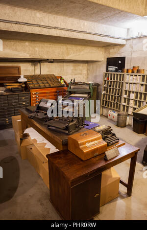 Print shop interior in Warsaw Uprising Museum (Warsaw Rising Museum) in Warsaw, Poland, room with original typewriters and printing equipment, Polish  Stock Photo