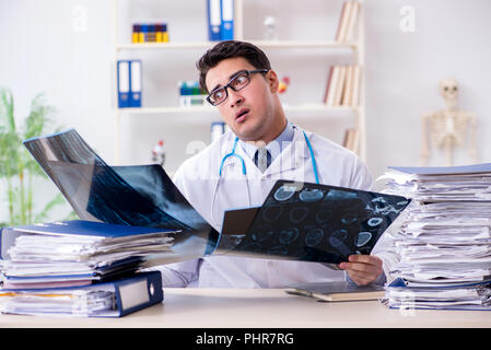 Tired radiologist with x-ray image in hospital Stock Photo - Alamy