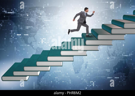 Businessman student climbing the ladder of education books Stock Photo