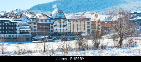 Bansko, Bulgaria - November 30, 2016: St. Ivan Rilski hotel and snow mountains panorama in bulgarian ski resort Bansko Stock Photo