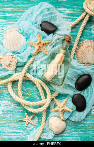 Seashells on turquoise background Stock Photo