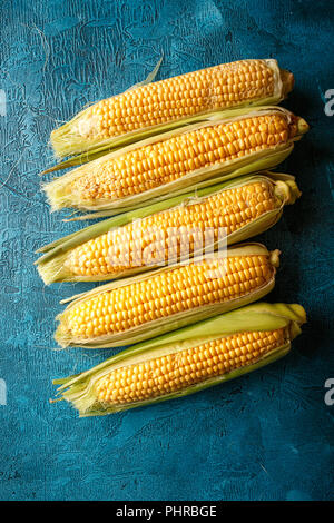 Fresh raw corn cobs Stock Photo