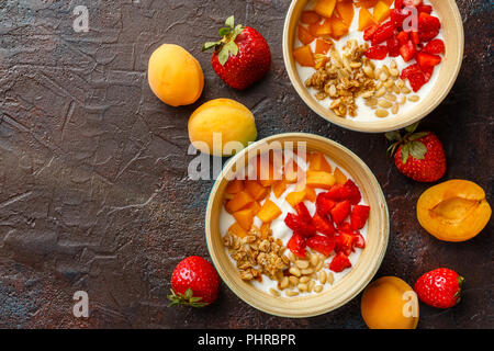 Homemade yogurt with granola, apricot and pine nuts Stock Photo