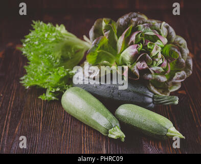 Zucchini with oakleaf lettuce Stock Photo