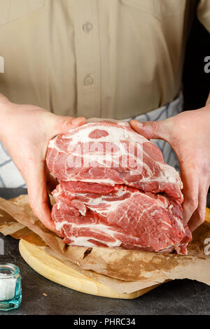 Close up of Male hands chopping knife pork Stock Photo